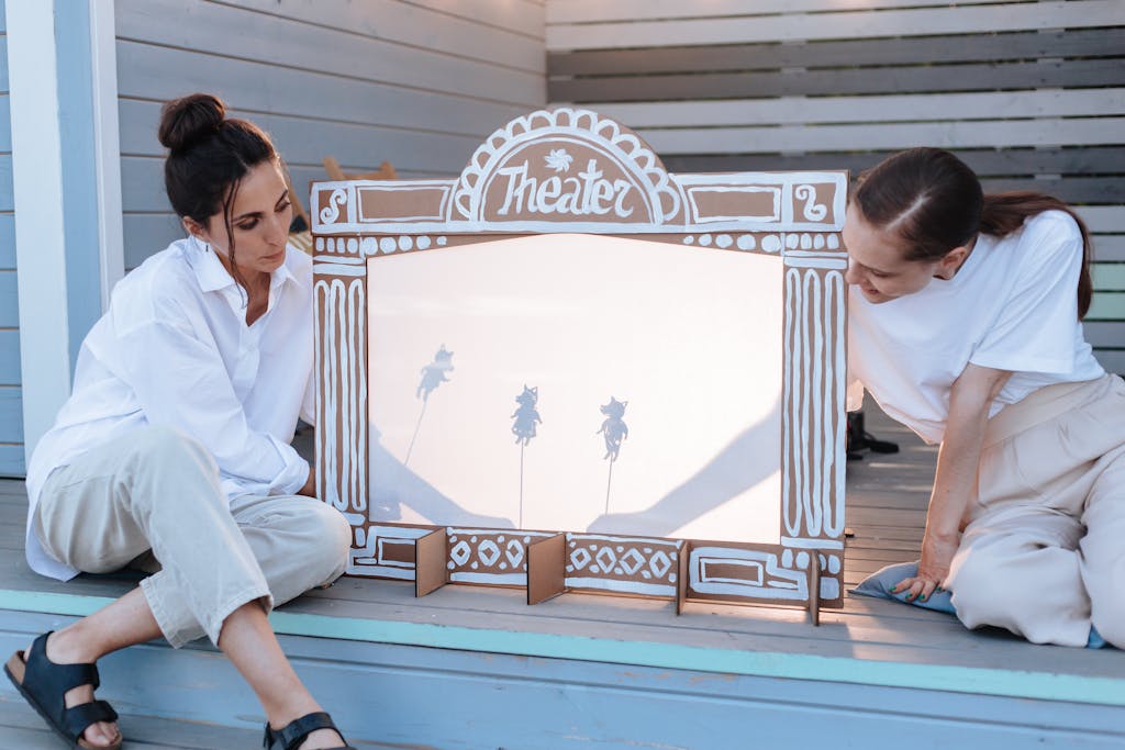 Women Performing Shadow Theatre on Deck